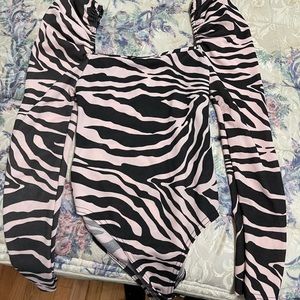 Pink zebra body suit